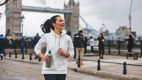 A young woman running in central London (Credit: Getty Images)